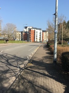 Outside the Red Dragon centre with a sign on the lamppost